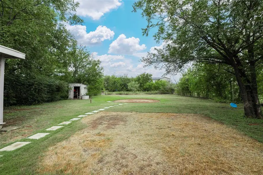 Exterior details and patio area of a home in , Early (Image 3). Exterior details and patio area of a home in , Early (Image 3).