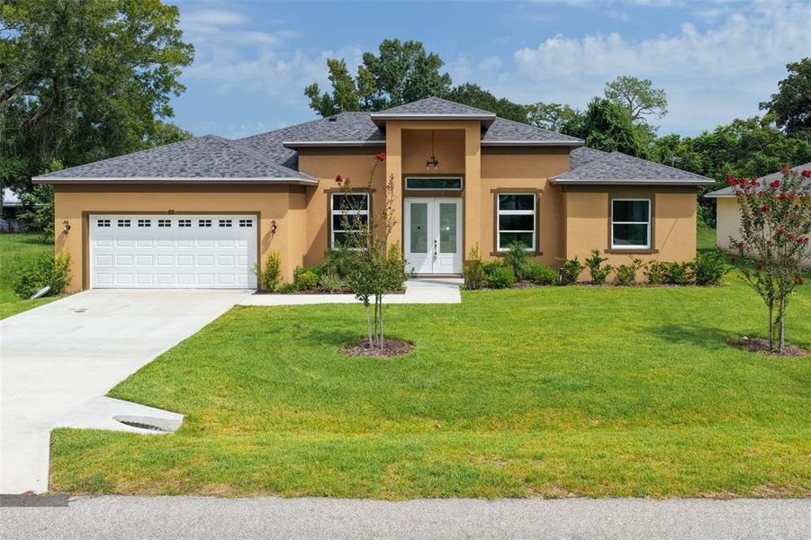Front exterior of a new home in , Palm Coast, FL, highlighting curb appeal (Image 26).