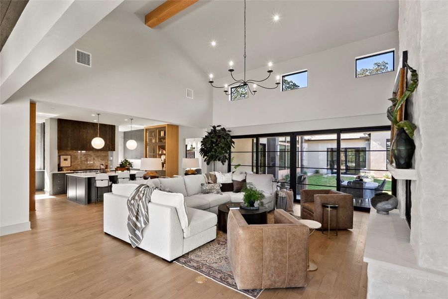 Open concept Living area with large sliding doors and windows over looking courtyard
