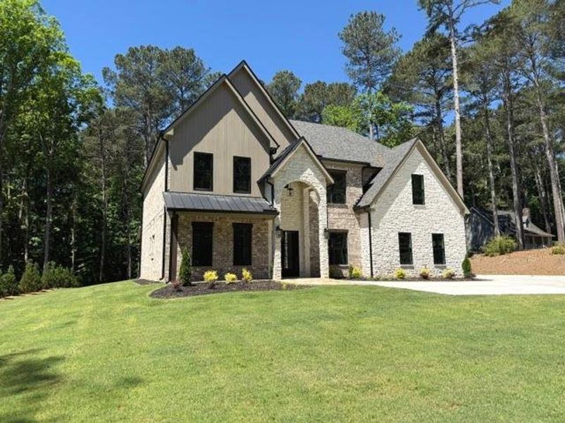 Front exterior of a new home in , Lawrenceville, GA, highlighting curb appeal (Image 1). Front exterior of a new home in , Lawrenceville, GA, highlighting curb appeal (Image 1).