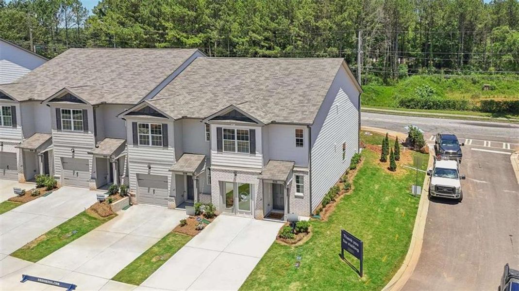 Front exterior of a new home in Wellington Park, Lithonia, GA, highlighting curb appeal (Image 21).