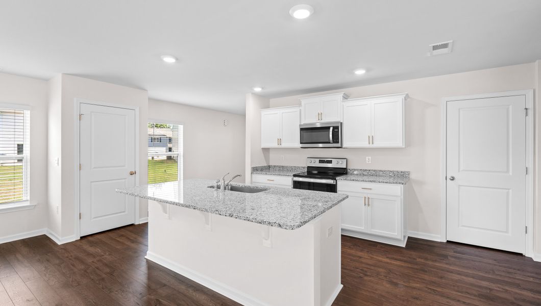 Representative furnished interior of a home built from the ELSTON by D.R. Horton in Harrier Point, Woodruff (Image 5).