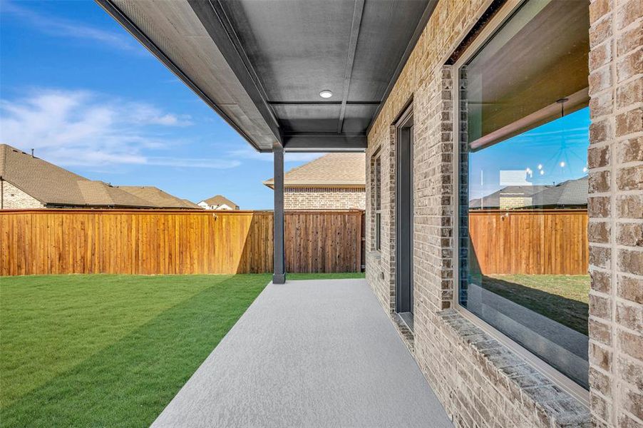 Exterior details and patio area of a home in Creekshaw – Classic, Royse City (Image 2). Exterior details and patio area of a home in Creekshaw – Classic, Royse City (Image 2).