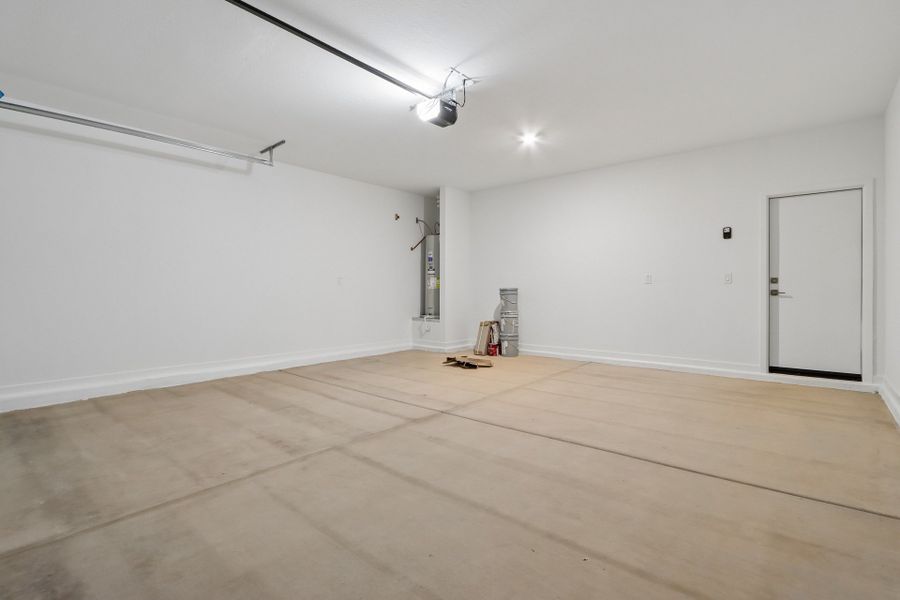 A room with white walls and a wood floor.