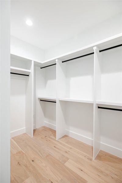 The spacious walk-in closet offers abundant organization options, ensuring everything has its place while maintaining a sleek, clutter-free aesthetic.