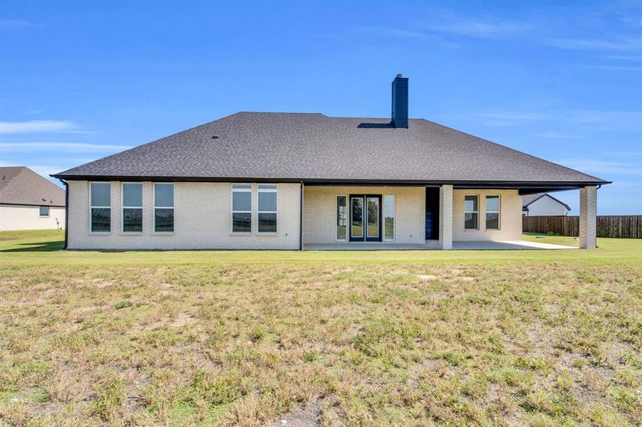 Front exterior of a new home in Springside Estates II, Waxahachie, TX, highlighting curb appeal (Image 16).
