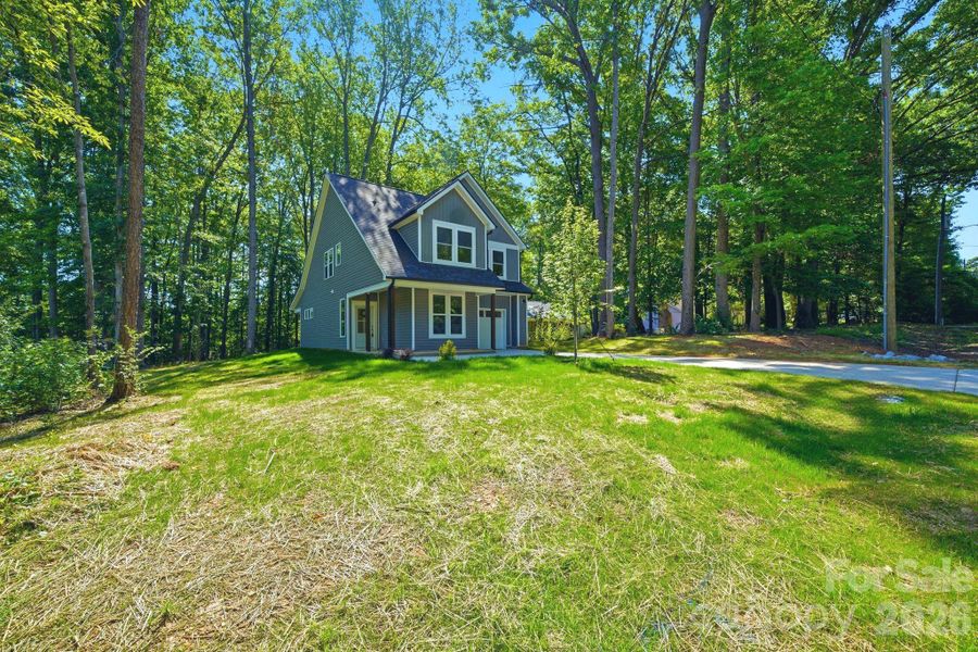 Front exterior of a new home in , Charlotte, NC, highlighting curb appeal (Image 26).