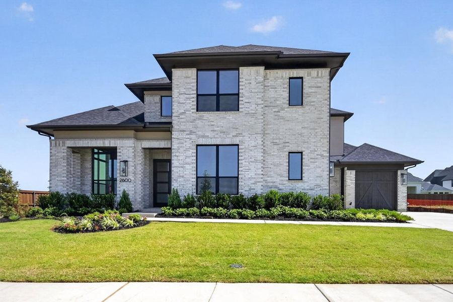 Front exterior of a new home in Cambridge Crossing, Celina, TX, highlighting curb appeal (Image 1). Front exterior of a new home in Cambridge Crossing, Celina, TX, highlighting curb appeal (Image 1).
