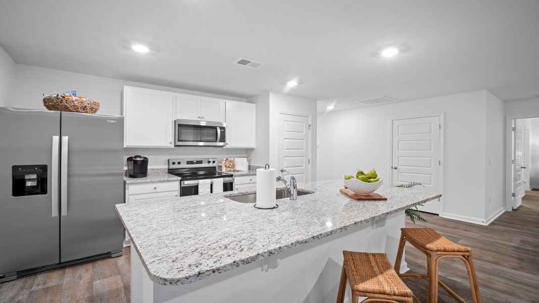 Representative furnished interior of a home built from the Freeport by D.R. Horton in Palm Ridge, Guyton (Image 5).