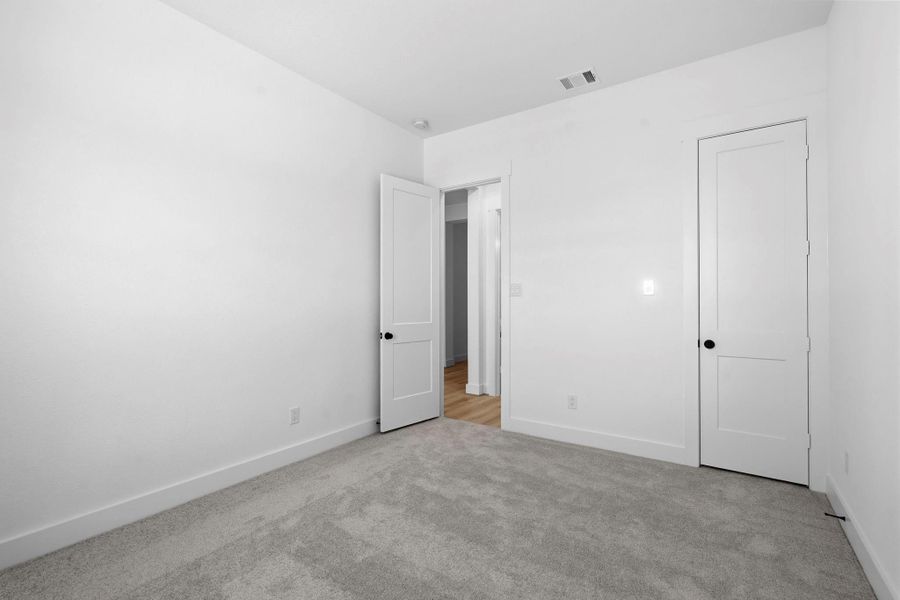 Finishes like luxurious ceramic tile flooring, brushed nickel or matte black fixtures, and soft, neutral tones tie the room together, creating a spa-like retreat within the home.