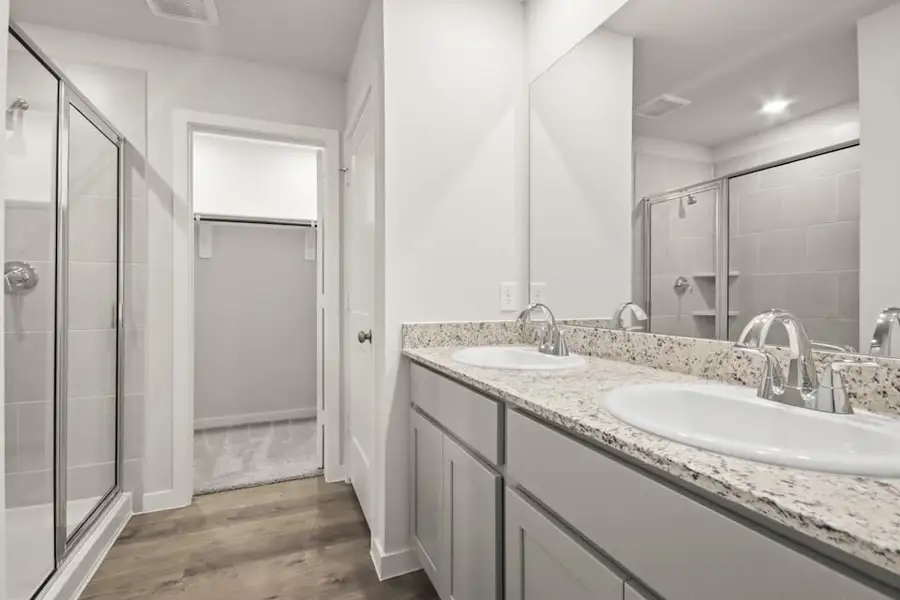 A bathroom with a glass shower.