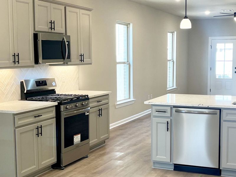 Front exterior of a new home in Emberly, Beasley, TX, highlighting curb appeal (Image 9).
