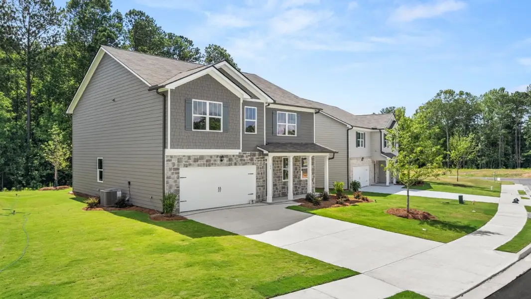 Representative exterior photo of a completed home built from the Hanover by D.R. Horton in Northwoods at Mirror Lake, Villa Rica, GA (Image 2).