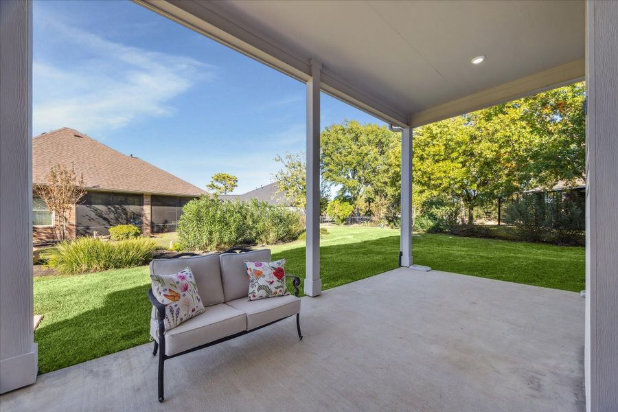 Ideally positioned Covered Back Porch sheltered by trees on the East Side. The Lot is an oversized Pie Shape with loads of room for a pool and Back Yard Sports.