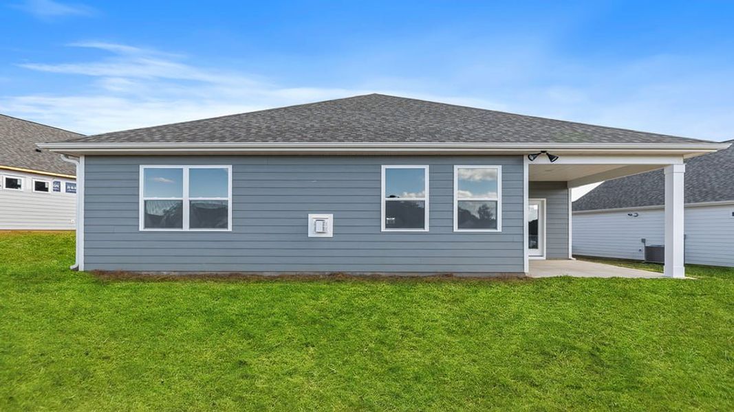 Exterior details and patio area of a home in The Villas at Pine Valley, Boiling Springs (Image 2).