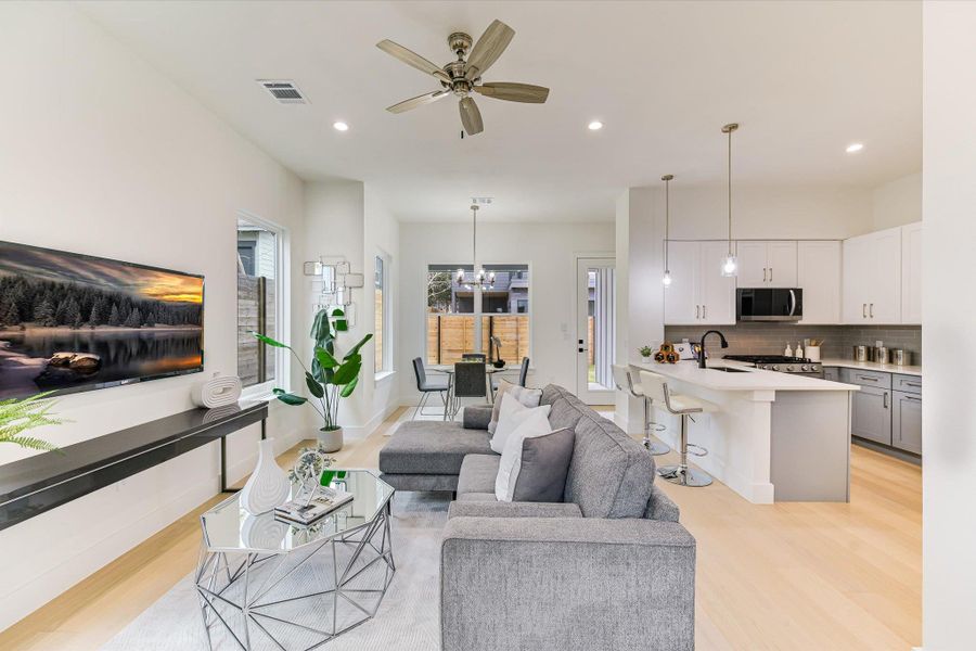 Large-scale windows invite the Texas sunshine in, creating an inviting space perfect for morning coffee or evening cocktails.