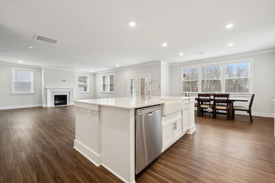 A large kitchen with white cabinets. A large kitchen with white cabinets.
