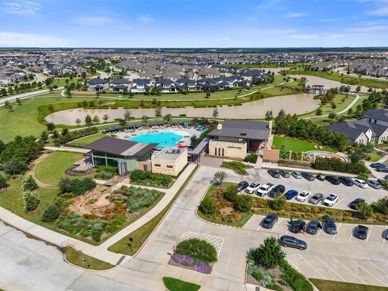 This photo highlights the new Lakeside Landing amenity center, which is just a short walk from the home. The center includes a resort-style pool with a lap lane for fitness and multiple lounging areas for relaxation.