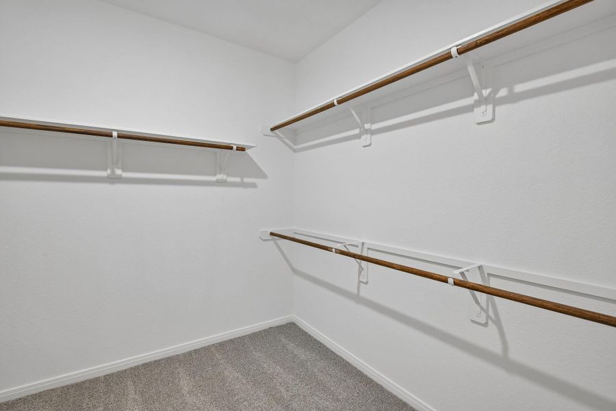 Primary walk-in closet Primary walk-in closet