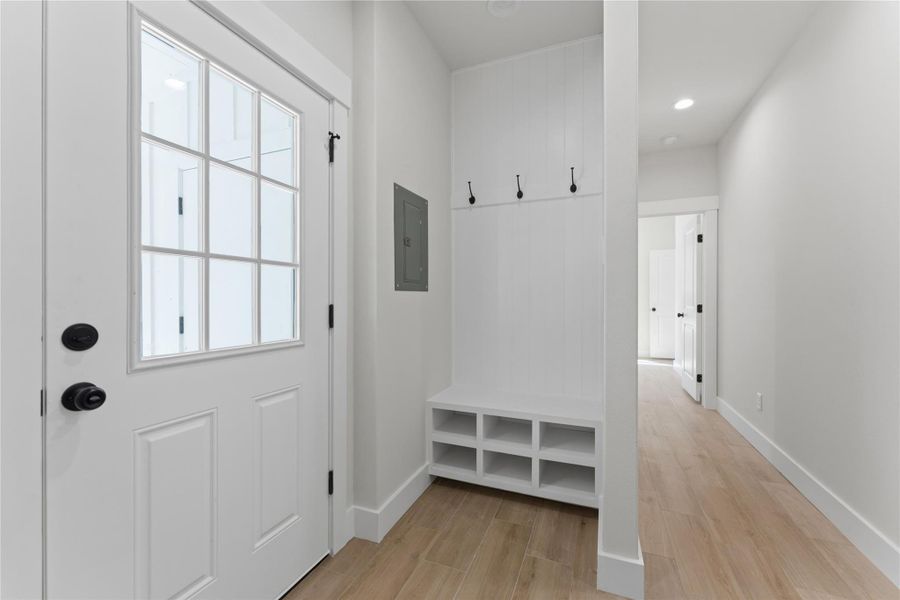 A thoughtfully designed built-in drop zone provides the perfect spot for shoes, bags, and everyday essentials.