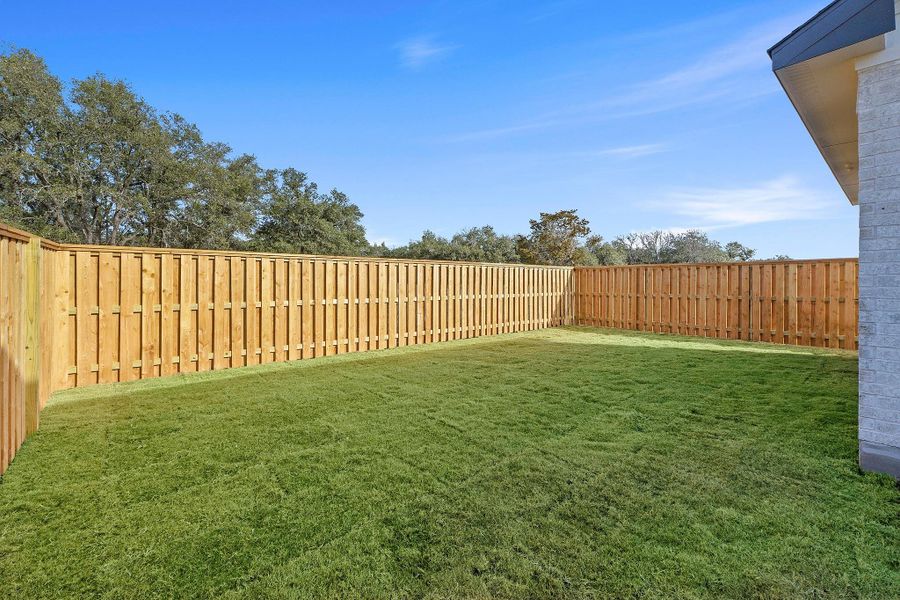 Exterior details and patio area of a home in Parmer Ranch, Georgetown (Image 24).