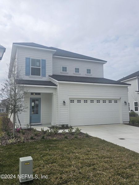 Front exterior of a new home in TrailMark, St. Augustine, FL, highlighting curb appeal (Image 2).