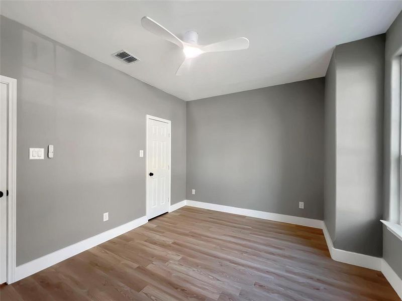 Spare room featuring ceiling fan and light hardwood / wood-style flooring