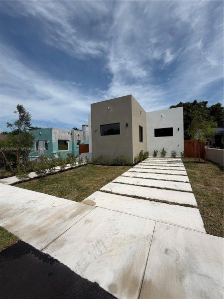 Front exterior of a new home in , Miami, FL, highlighting curb appeal (Image 2). Front exterior of a new home in , Miami, FL, highlighting curb appeal (Image 2).