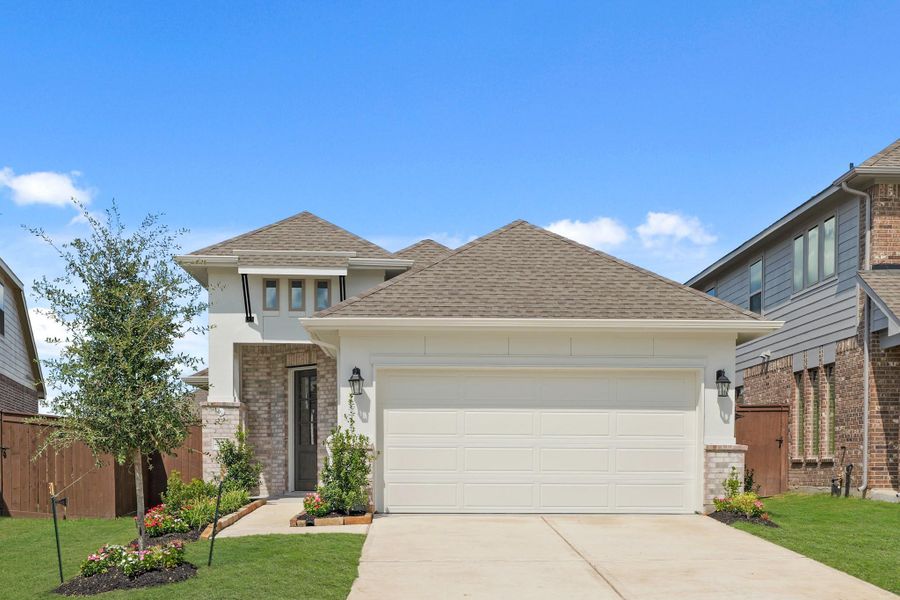 Front exterior of a new home in The Trails, New Caney, TX, highlighting curb appeal (Image 19). Front exterior of a new home in The Trails, New Caney, TX, highlighting curb appeal (Image 19).