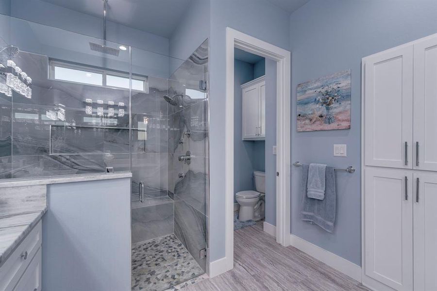 Bathroom with huge shower with 2 separate full body sprayers and a rain head