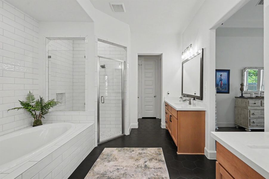 There is a linen closet and two separate closets in the bathroom. An electrical outlet was added to one of the closets along with extended shelving and built-in storage. There is a linen closet and two separate closets in the bathroom. An electrical outlet was added to one of the closets along with extended shelving and built-in storage.