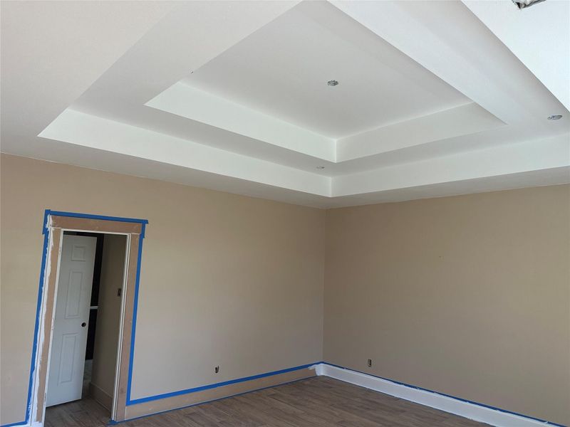 Retreat to a spacious primary suite accented by high ceilings and an open, airy feel. Retreat to a spacious primary suite accented by high ceilings and an open, airy feel.