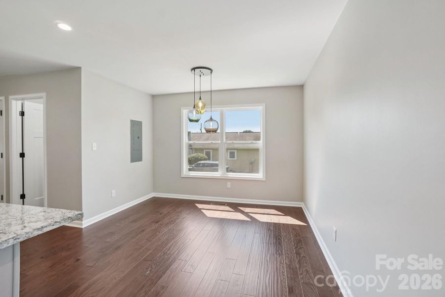 Dining area with lighting designed by local glass artist for 17 White Avenue!