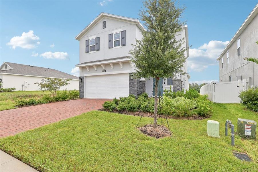 Front exterior of a new home in Eagletail Landings, Howey-in-the-Hills, FL, highlighting curb appeal (Image 21).
