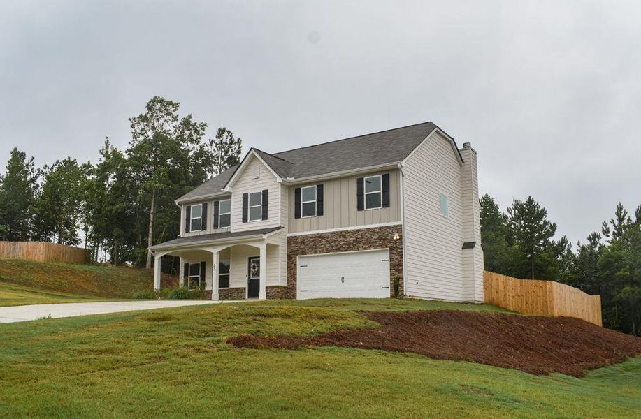 Front exterior of a new home in , Dallas, GA, highlighting curb appeal (Image 26). Front exterior of a new home in , Dallas, GA, highlighting curb appeal (Image 26).