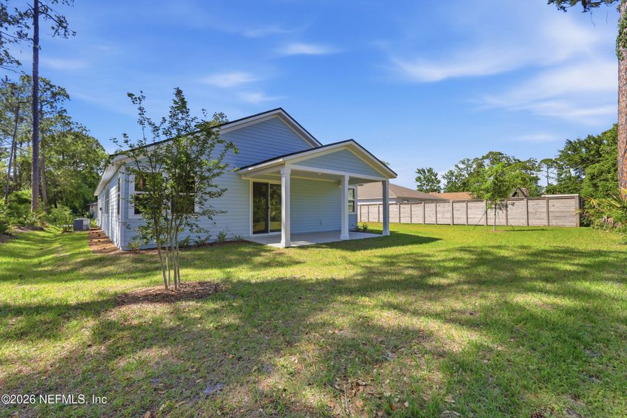 Exterior details and patio area of a home in Palm Coast Homes, Palm Coast (Image 3).