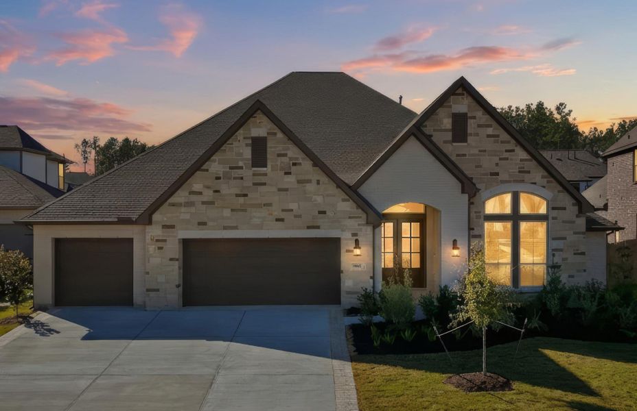 Front exterior of a new home in Artavia 70′, Conroe, TX, highlighting curb appeal (Image 2). Front exterior of a new home in Artavia 70′, Conroe, TX, highlighting curb appeal (Image 2).