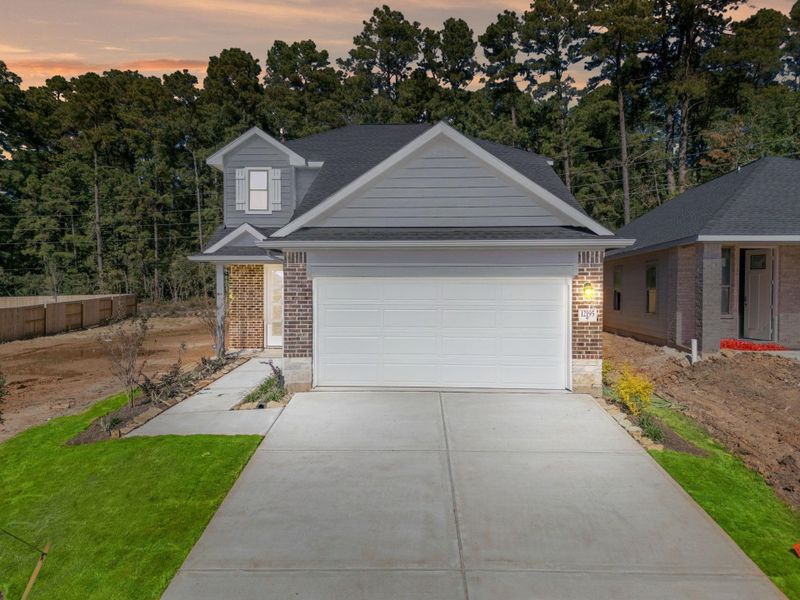 Front exterior of a new home in Westridge Cove, Conroe, TX, highlighting curb appeal (Image 2). Front exterior of a new home in Westridge Cove, Conroe, TX, highlighting curb appeal (Image 2).