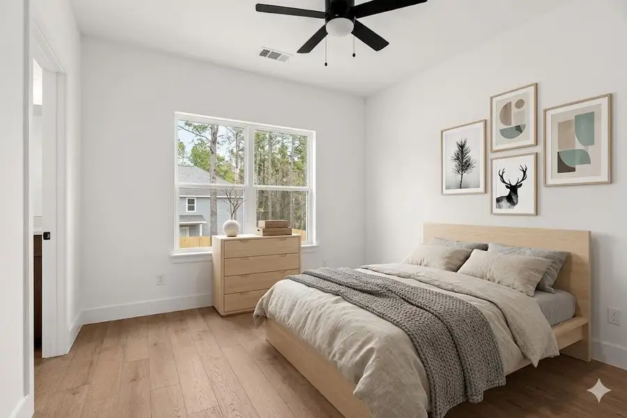 Bedroom featuring light wood-style floors and ceiling fan