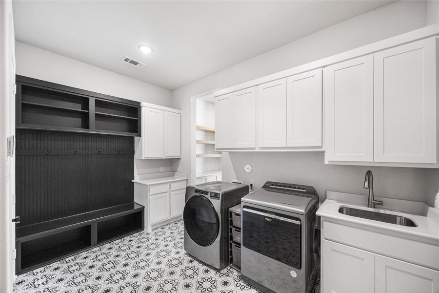Laundry area with built-ins and sink.