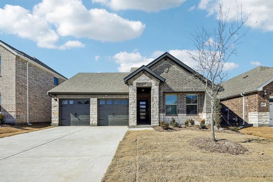 Front exterior of a new home in Parks at Foster Crossing - Signature Series, Anna, TX, highlighting curb appeal (Image 1). Front exterior of a new home in Parks at Foster Crossing - Signature Series, Anna, TX, highlighting curb appeal (Image 1).