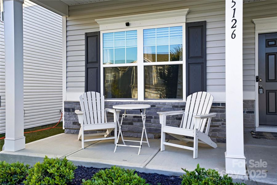 Exterior details and patio area of a home in Orchard Creek, Charlotte (Image 2).