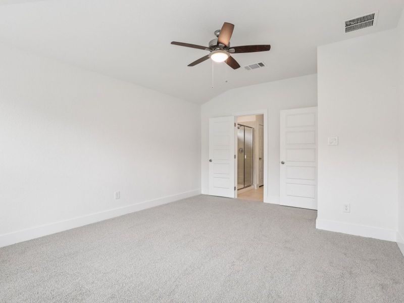 Primary bedroom in the Callaghan floorplan at a Meritage Homes community.