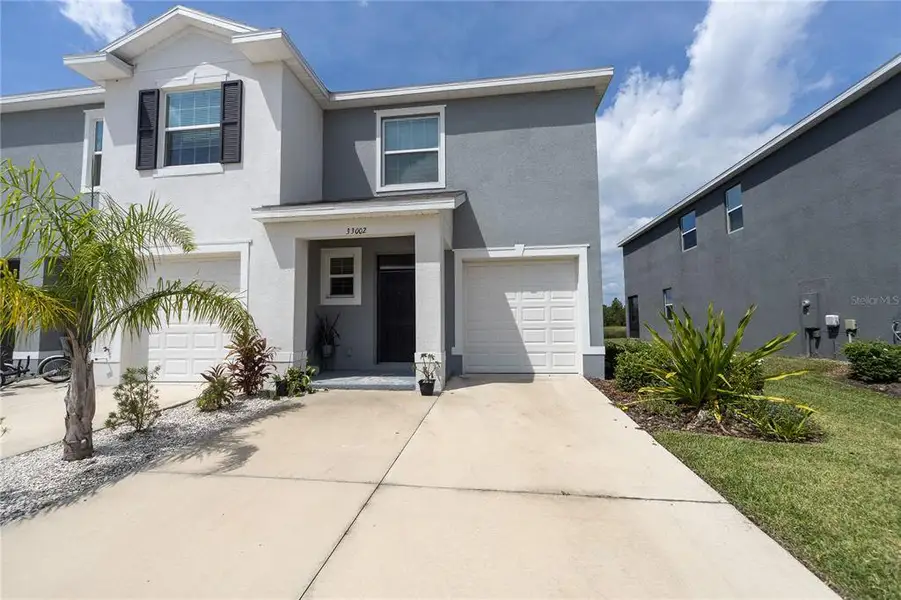 Front exterior of a new home in , Wesley Chapel, FL, highlighting curb appeal (Image 16). Front exterior of a new home in , Wesley Chapel, FL, highlighting curb appeal (Image 16).