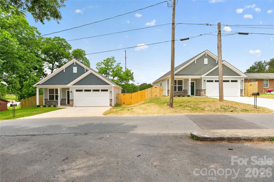 Front exterior of a new home in , Monroe, NC, highlighting curb appeal (Image 18).