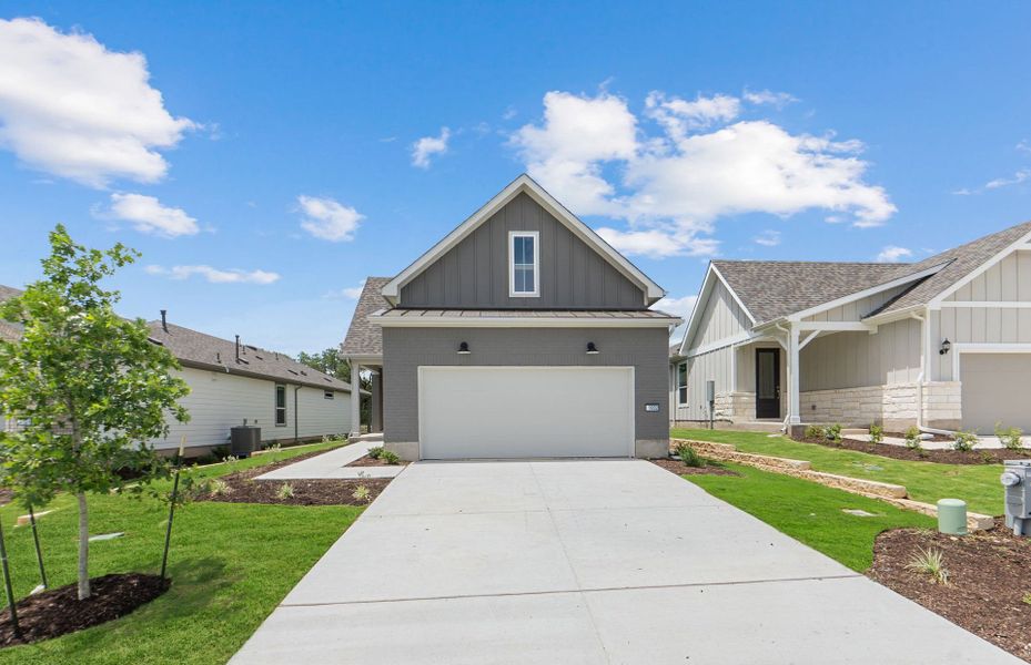 Front exterior of a new home in Sun City Texas, Georgetown, TX, highlighting curb appeal (Image 2). Front exterior of a new home in Sun City Texas, Georgetown, TX, highlighting curb appeal (Image 2).
