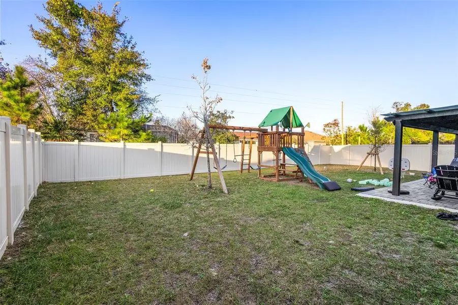 Exterior details and patio area of a home in Cadence at Parc Hill, Orange City (Image 3).