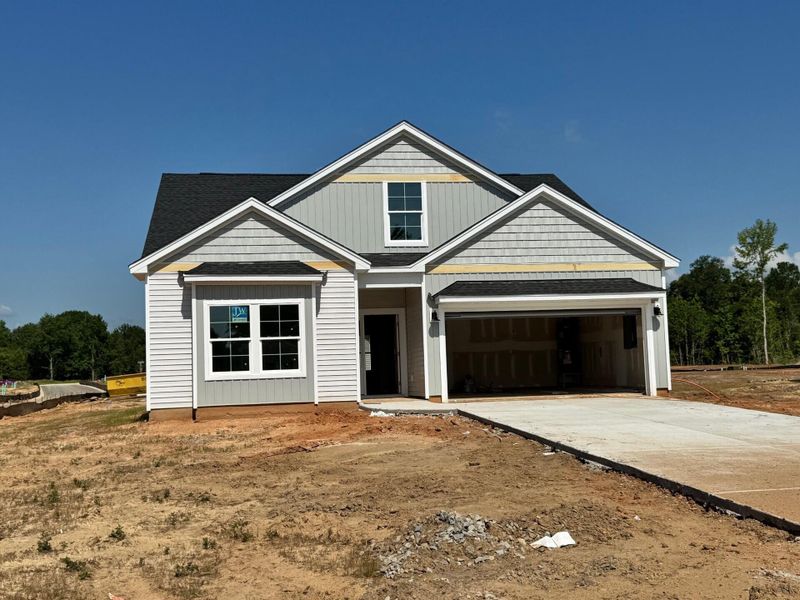 Front exterior of a new home in Fairway Woods at Wyboo, Manning, SC, highlighting curb appeal (Image 2).