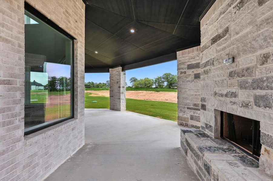 View of patio / terrace with an outdoor stone fireplace
