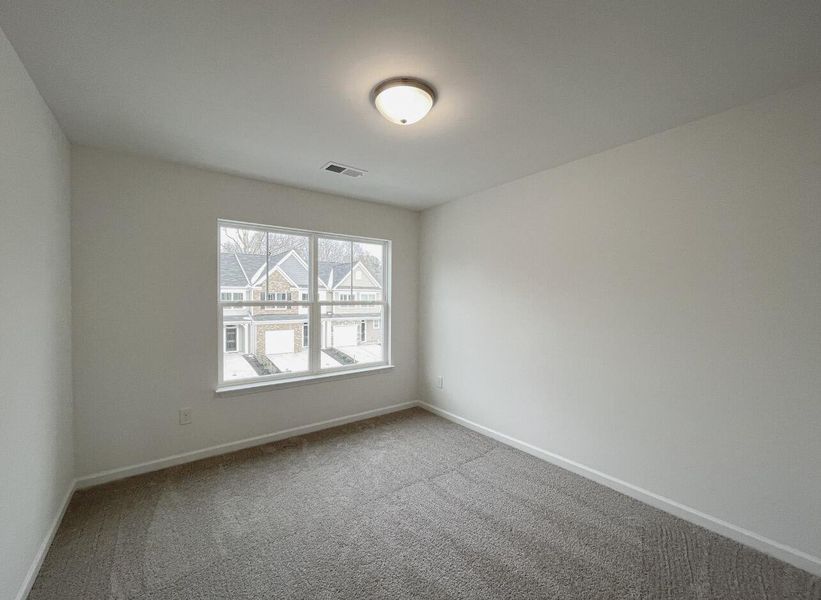 Spacious, unfurnished interior of a new home in East Main Townes, Spartanburg (Image 22).